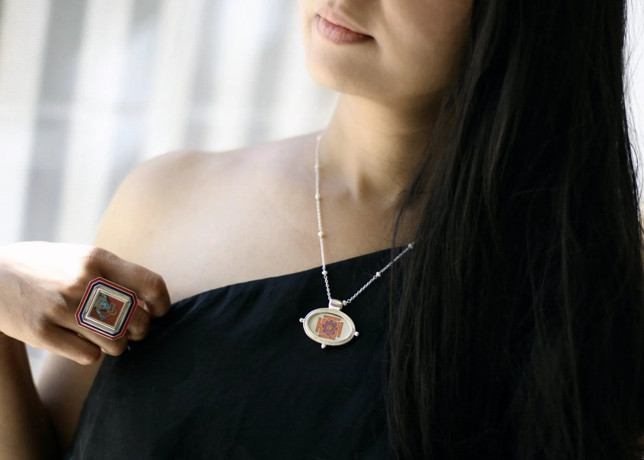 Exquisite, oval Lotus Yantra pendant on a floating pearl chain