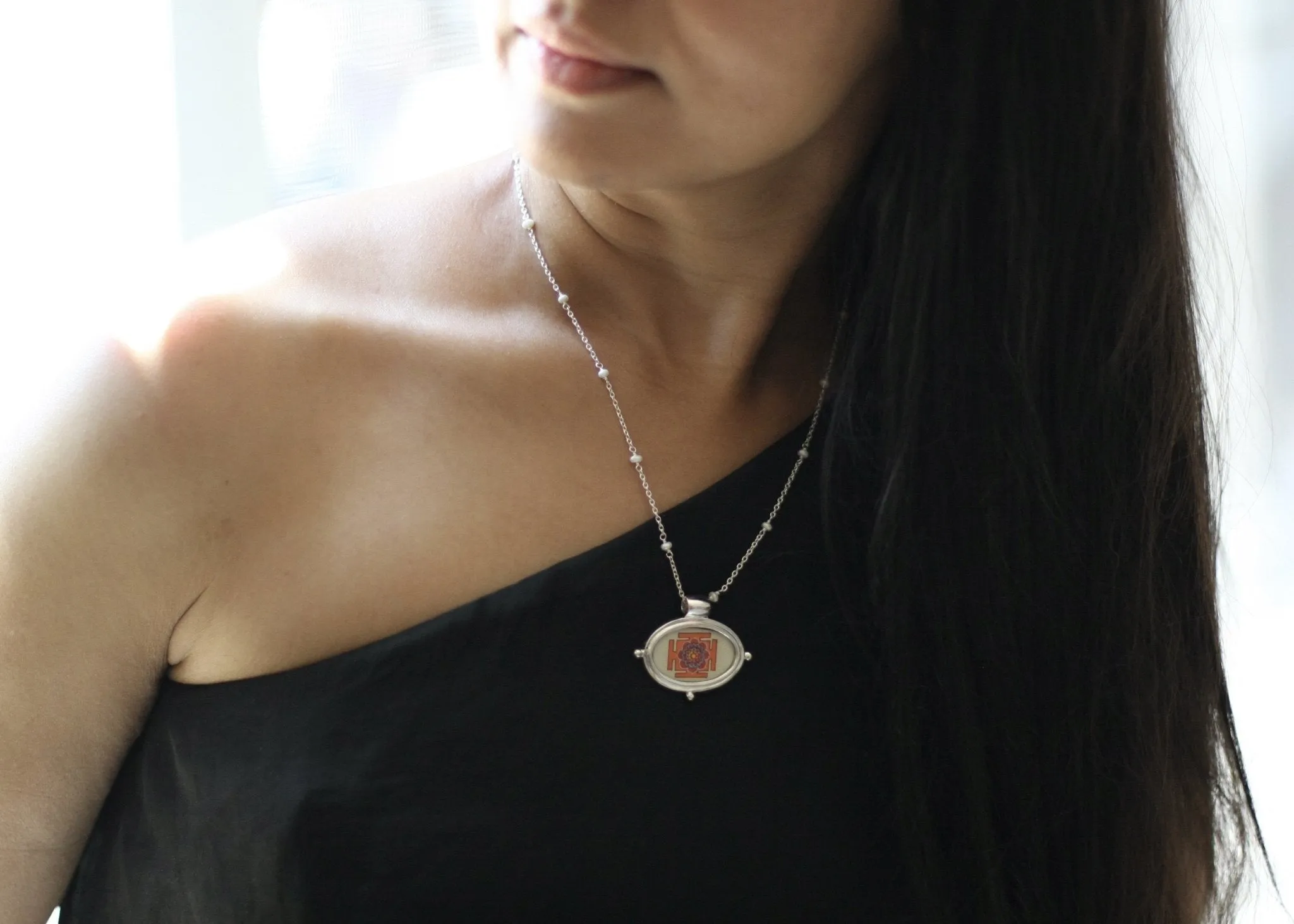 Exquisite, oval Lotus Yantra pendant on a floating pearl chain