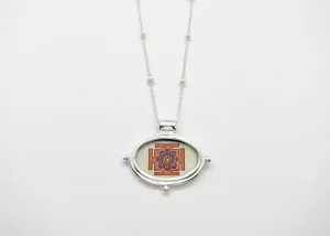 Exquisite, oval Lotus Yantra pendant on a floating pearl chain