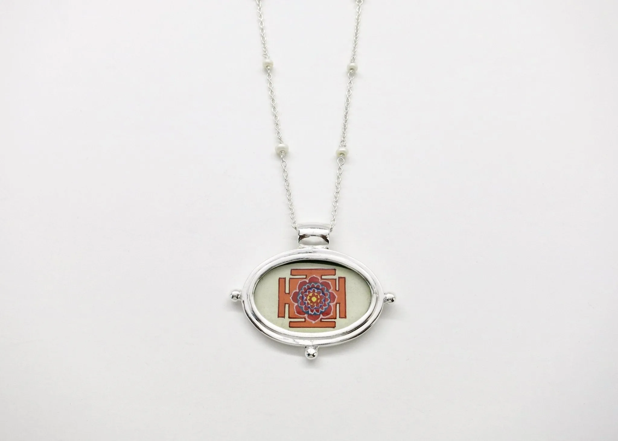 Exquisite, oval Lotus Yantra pendant on a floating pearl chain
