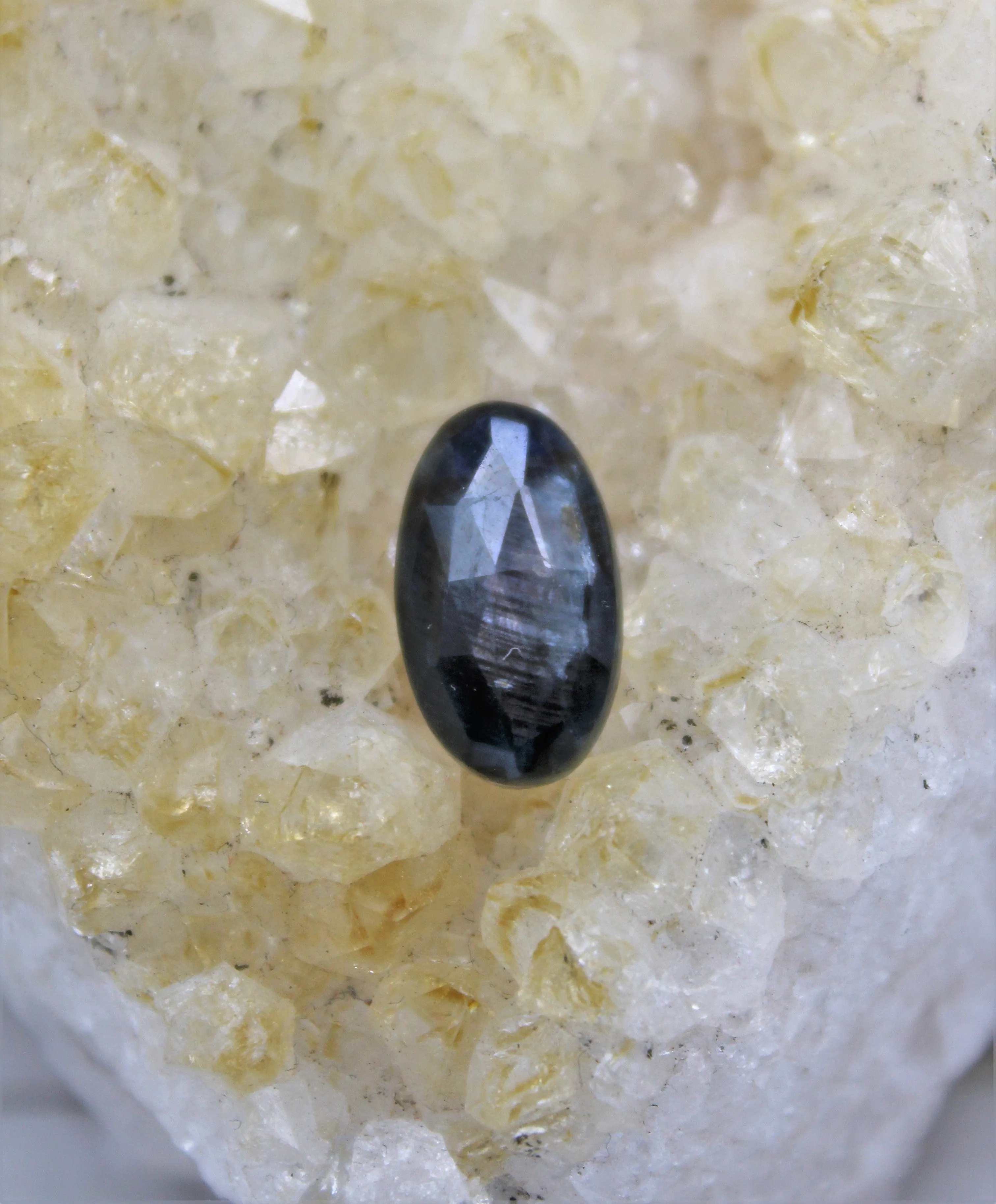 Faceted Eye of Odin Grey/Silver Sapphire Cabochon