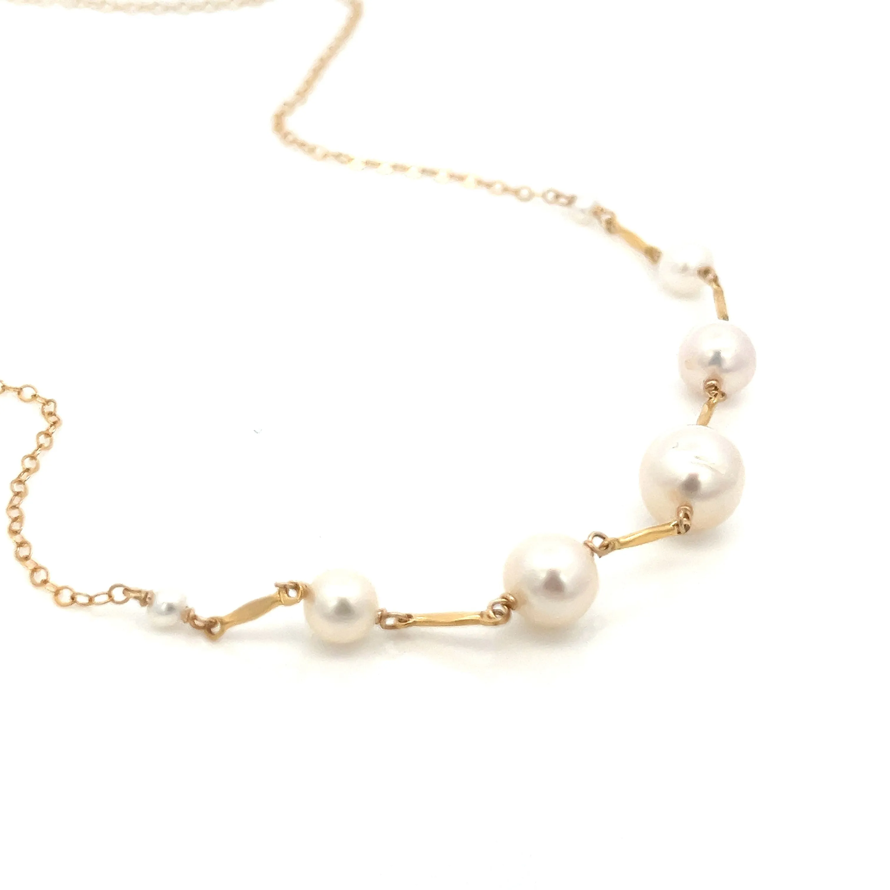 graduated five-pearl and gold bar necklace