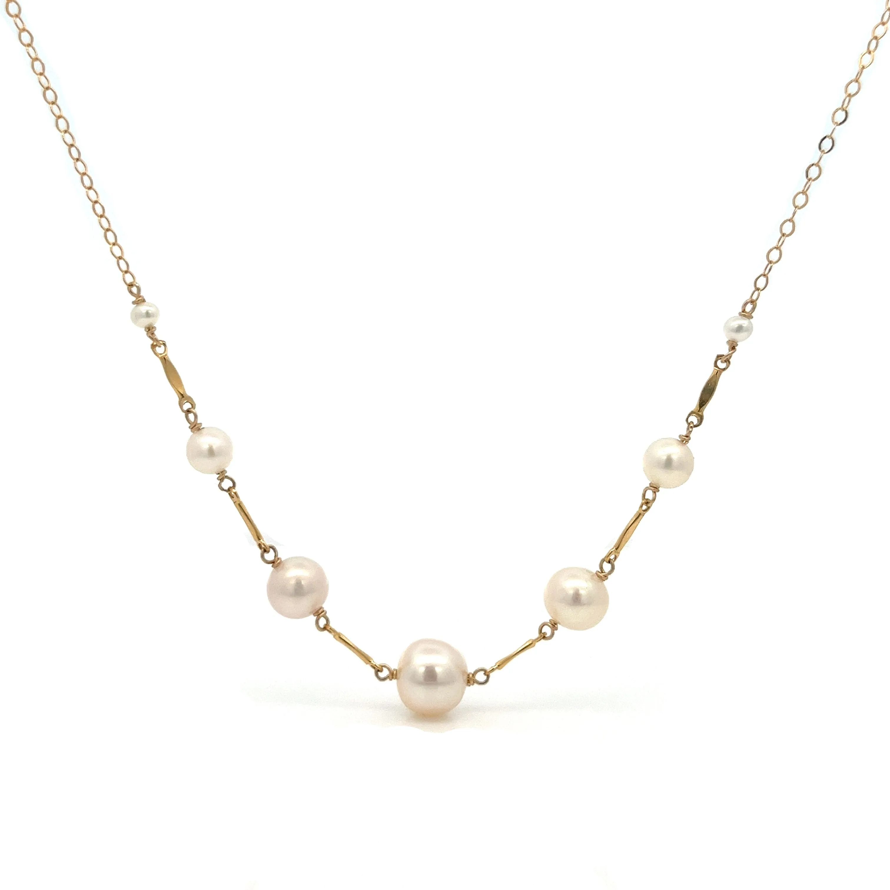 graduated five-pearl and gold bar necklace