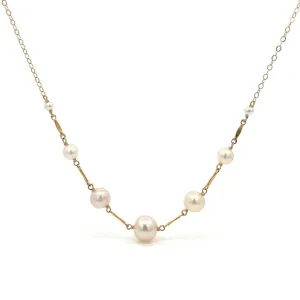 graduated five-pearl and gold bar necklace
