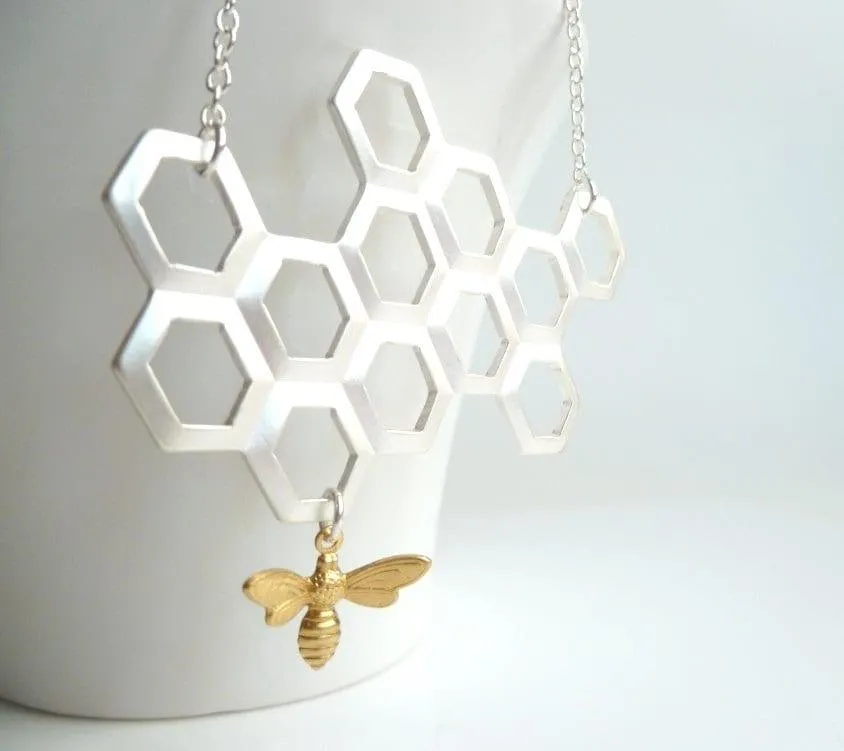 Honeycomb Necklace - gold brass bumblebee dangles from large bee hive pendant in matte silver on simple silver plated chain