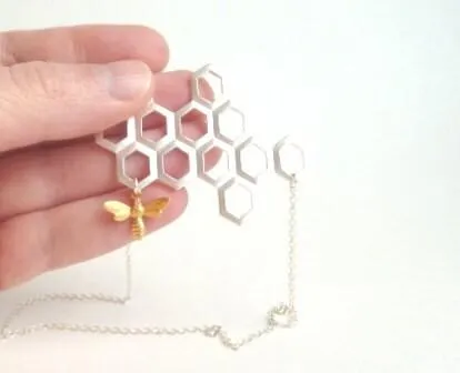 Honeycomb Necklace - gold brass bumblebee dangles from large bee hive pendant in matte silver on simple silver plated chain