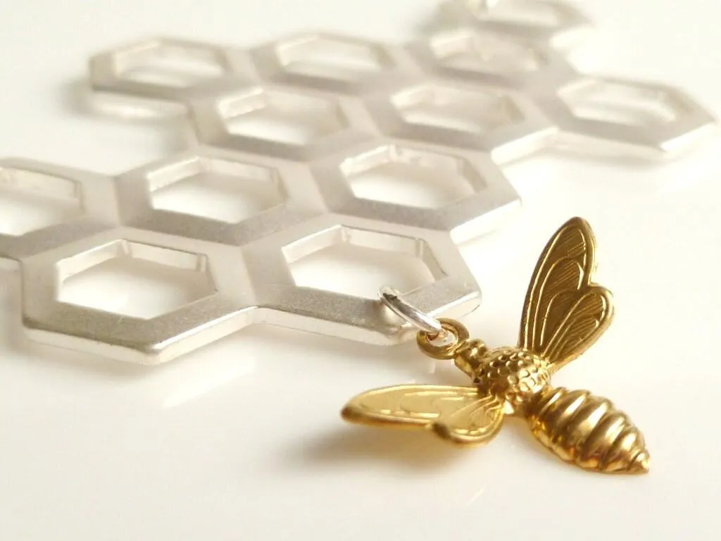 Honeycomb Necklace - gold brass bumblebee dangles from large bee hive pendant in matte silver on simple silver plated chain