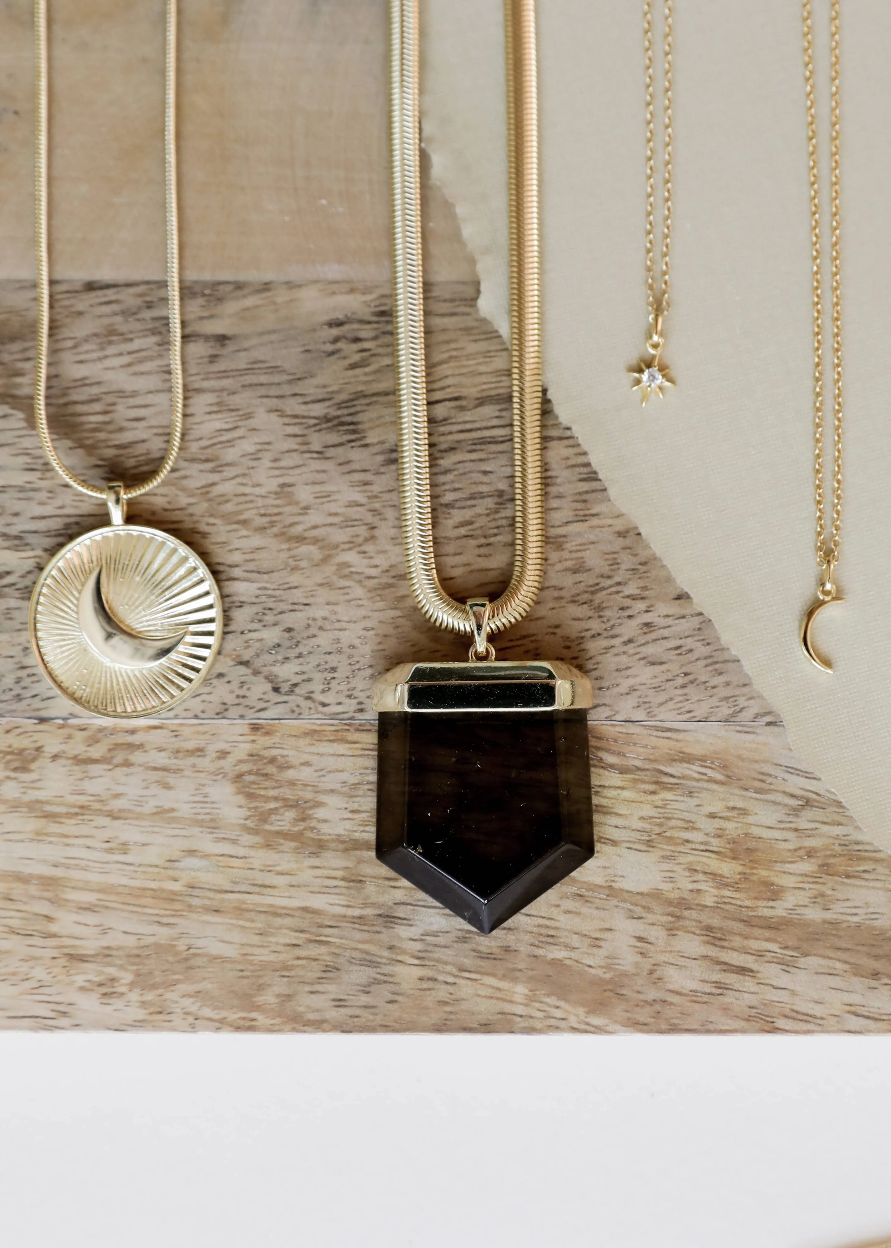 Tiny Crescent Moon Necklace by JaxKelly | Gold
